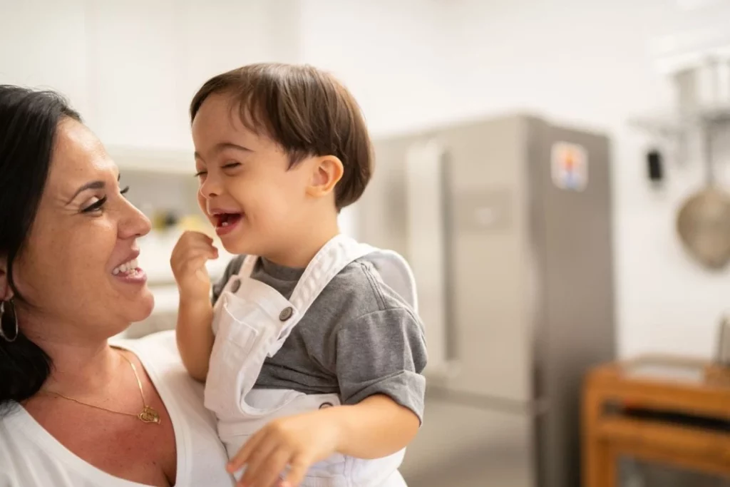 A mother lovingly embraces her child with Down Syndrome, showcasing the beauty of their unique bond.