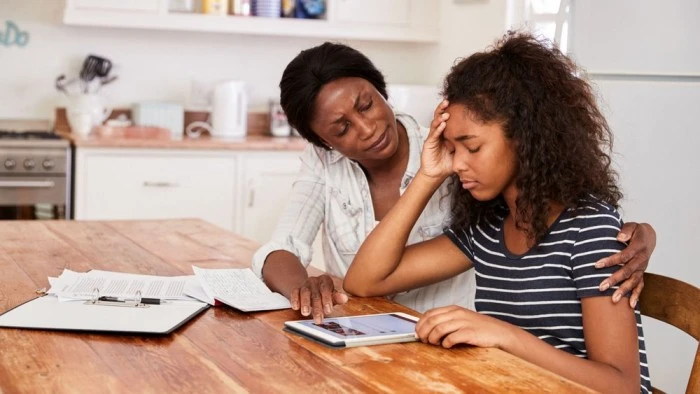 Image of a mom having a thoughtful discussion with her little girl, promoting emotional well-being through open communication