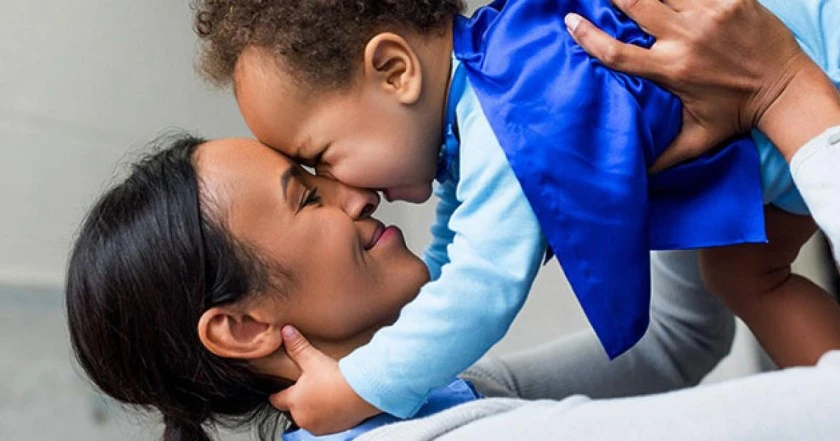 Image of a caring mother holding her baby, highlighting the importance of early intervention