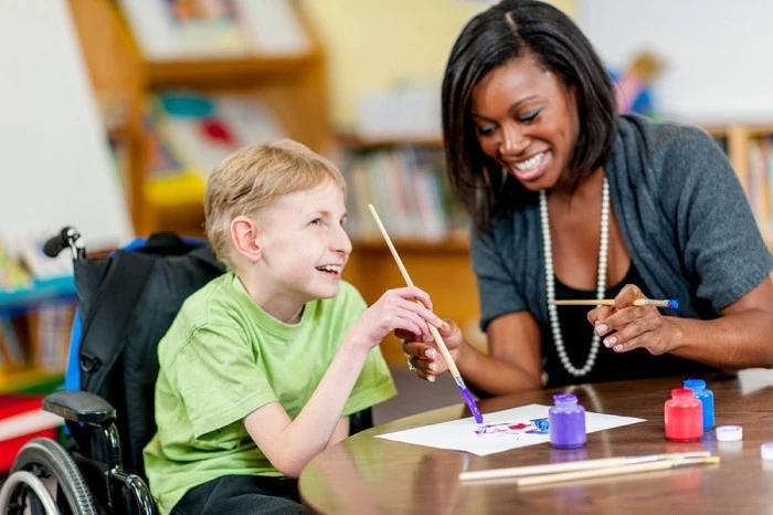 Teacher offering guidance and support to a student, emphasizing the importance of the Individualized Education Plan (IEP) in personalized learning.